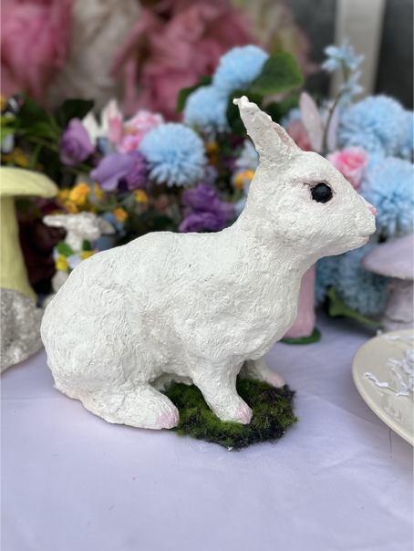 Bunny sculpture squatting